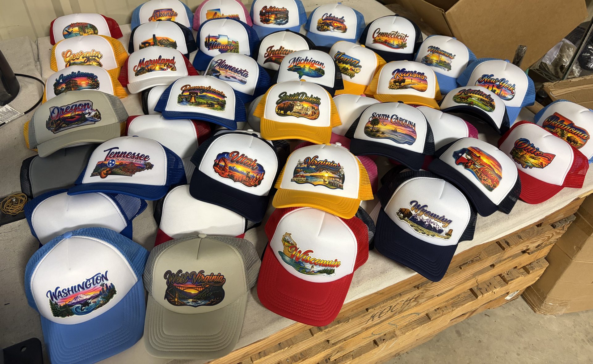 Lineup of TFN-decorated trucker hats in camo, leather patch, and canvas styles